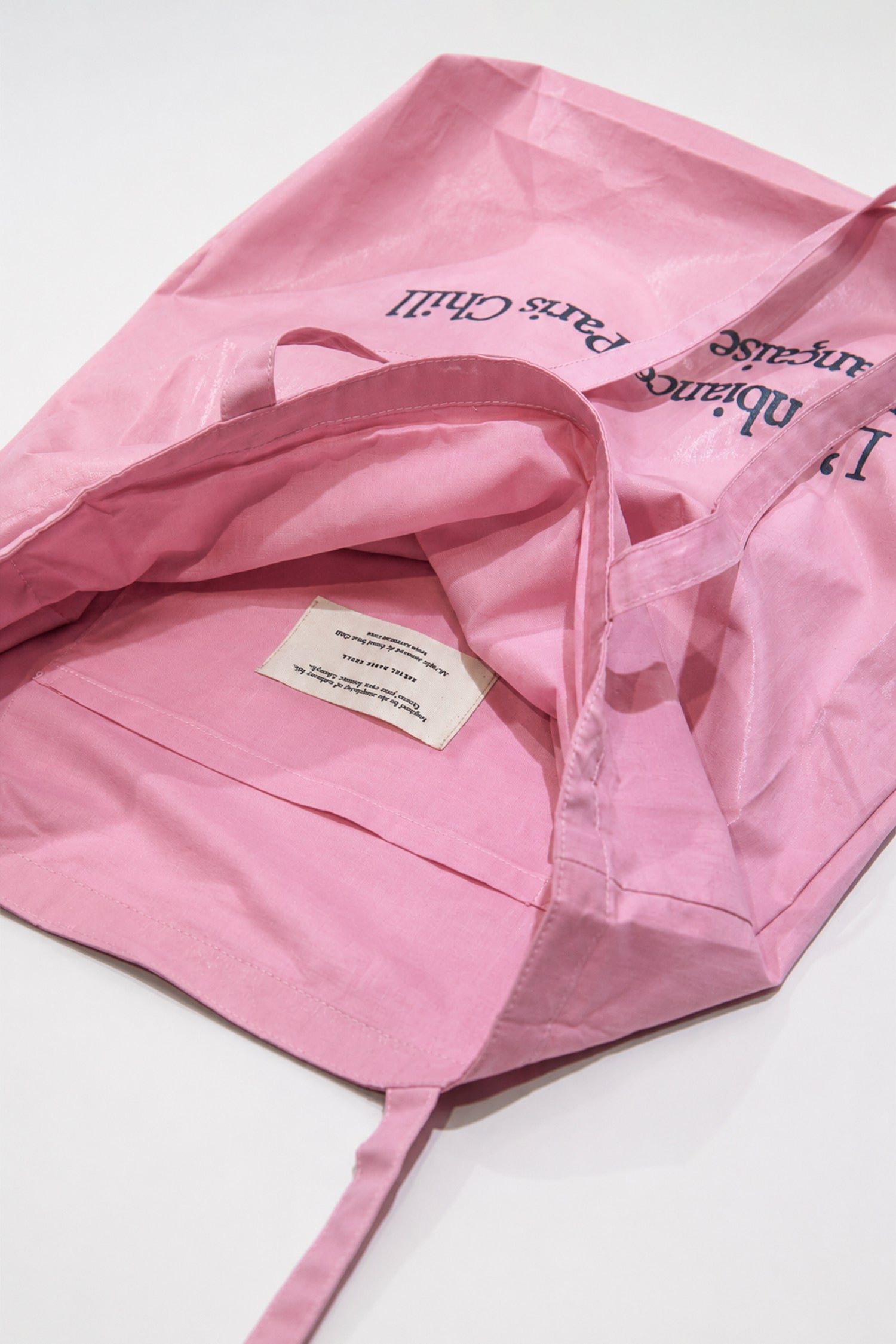 Side view of HÔTEL827 Sun Kissed pink canvas tote bag.