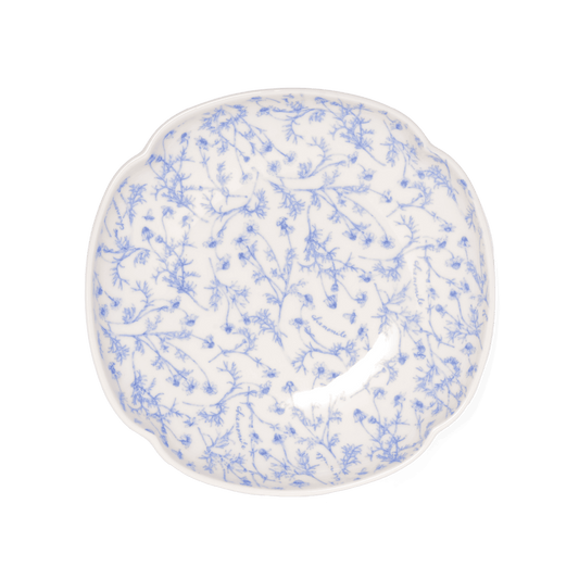 A pack shot of Studio M' Chamomile Deep Plate in a warm Japanese ceramic glaze, featuring a subtle floral relief along the rim, perfect for a minimalist Scandi table setting.
