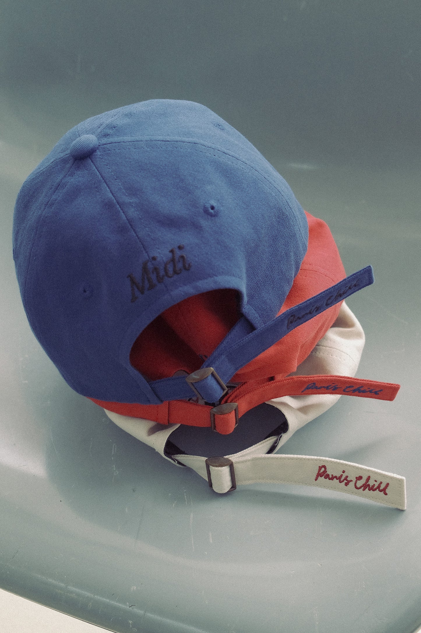 Back view of the stacked Hotel827 Sun Kissed baseball cap in different colours. 