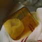 HÔTEL827 Overhaze Vanilla mouth blown borosilicate glass jar container with lid off in the sink.