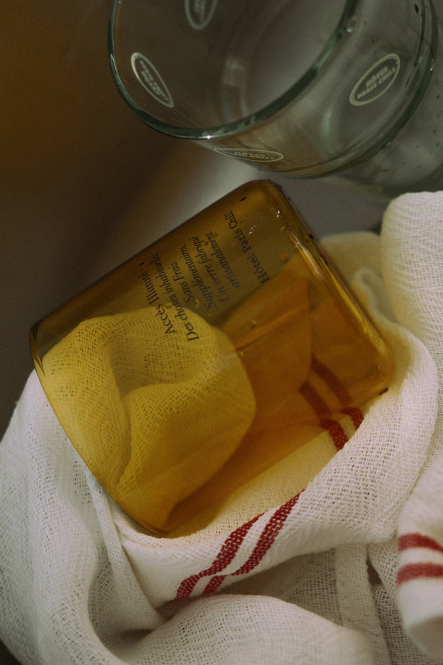 HÔTEL827 Overhaze Vanilla mouth blown borosilicate glass jar container with lid off in the sink.