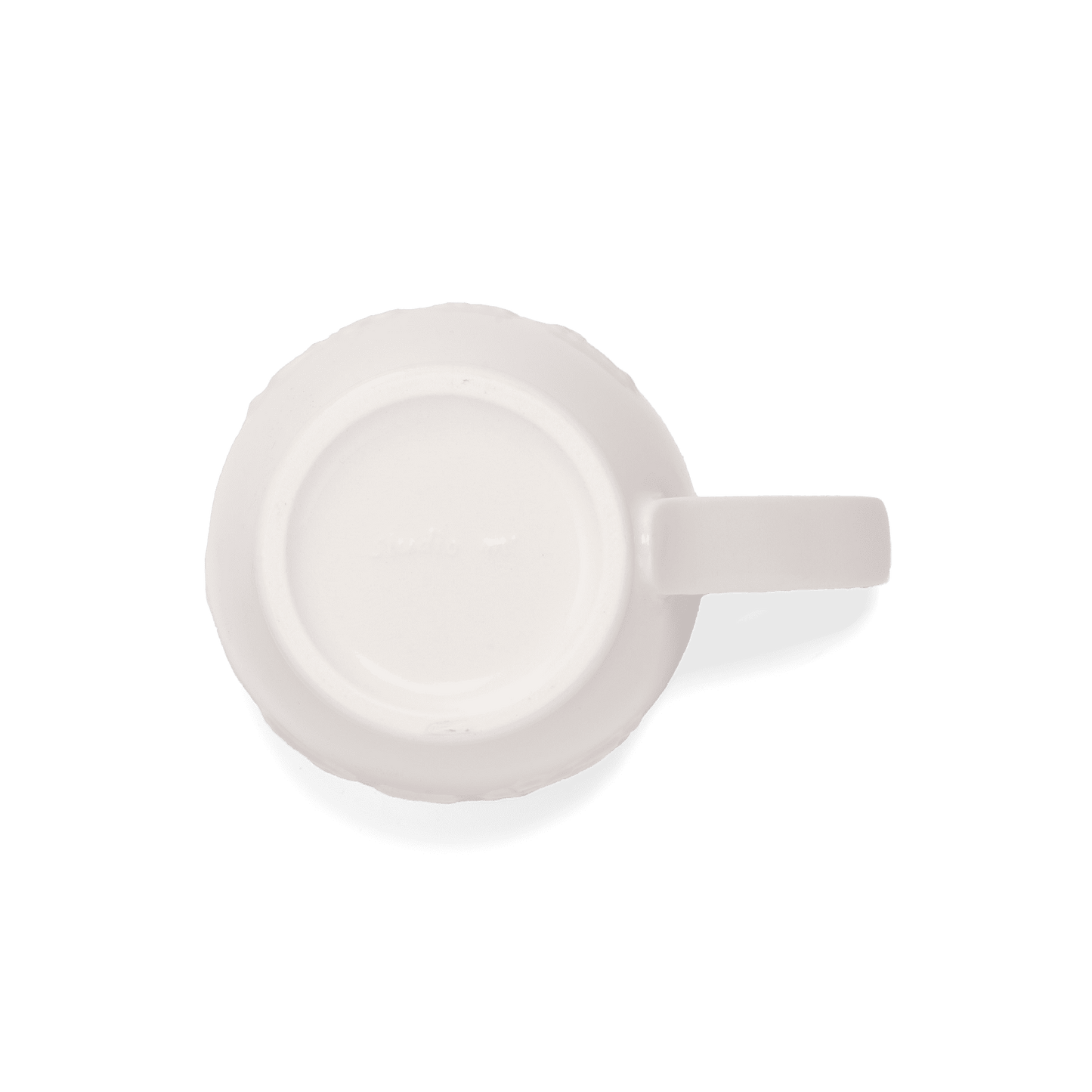 A pack shot of the base of Studio M' Creamware Latte Mug in a warm cream ceramic glaze.