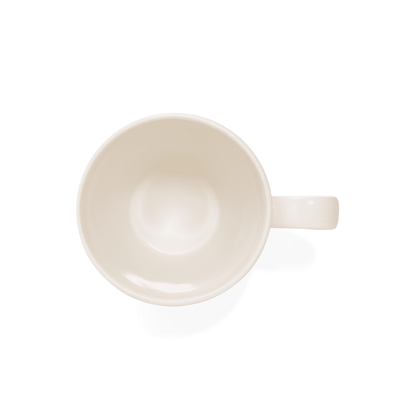 An aerial shot of Studio M' Creamware Latte Mug in a warm cream ceramic glaze.
