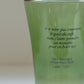 Close-up of artisanal mouth-blown ripples and typography on HÔTEL827 olive glass cup