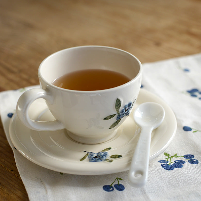 Studio M' Myrtille Cup with Saucer in warm cream ceramic, lighting up your mood when having afternoon tea.
