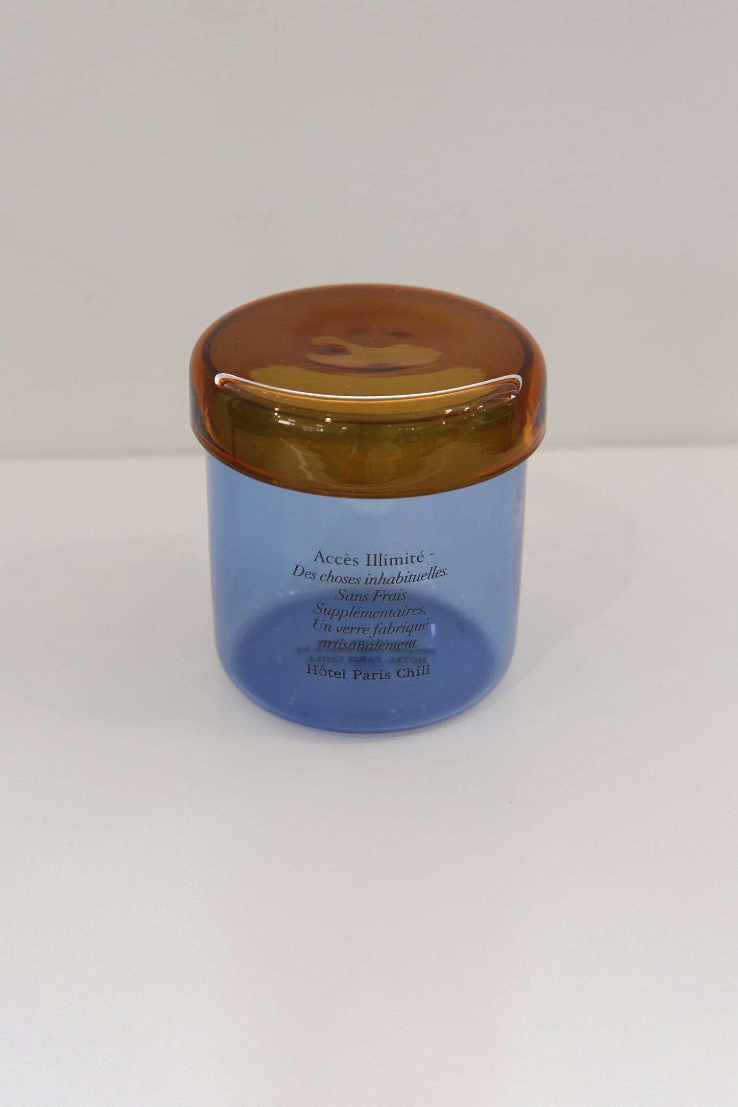 Aerial view of HÔTEL827 Overhaze Blue mouth blown borosilicate glass jar container with lid