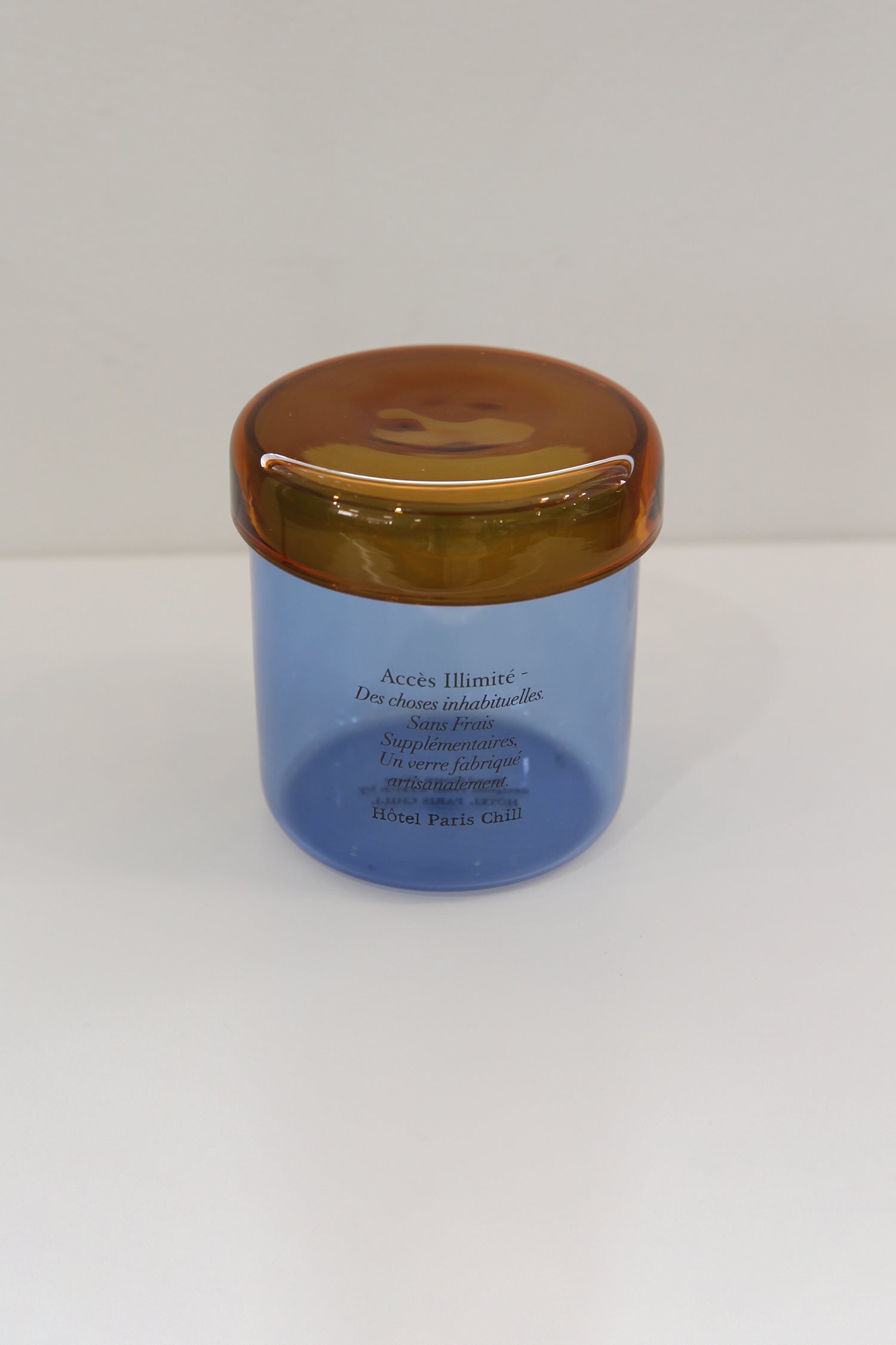 Aerial view of HÔTEL827 Overhaze Blue mouth blown borosilicate glass jar container with lid