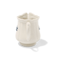 A side view of Studio M Early Bird small creamer from the handle.