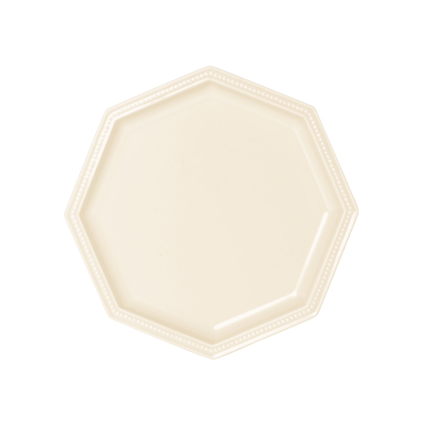 Studio M' Gatis Plate in a warm cream glaze, featuring an octagonal shape with a dotted rim detail, perfect for minimalist Scandi table settings.