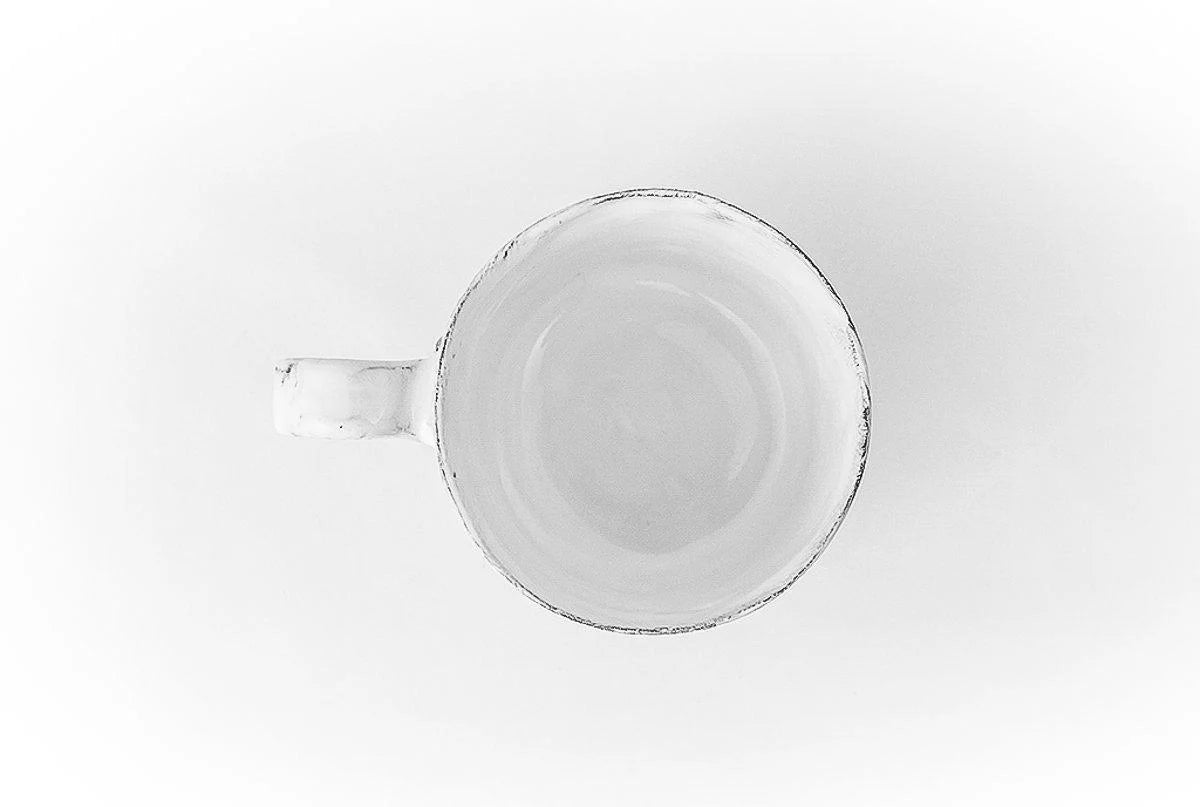 A top shot of Carron Paris ceramic mug with a signature small embossed knot.