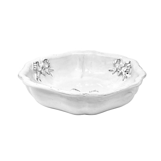Carron Paris Marie-Antoinette ribbon salad bowl in white enameled terracotta. A shot taken from the side angle.