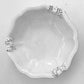 Carron Paris Marie-Antoinette ribbon salad bowl in white enameled terracotta. A shot taken from the high angle.