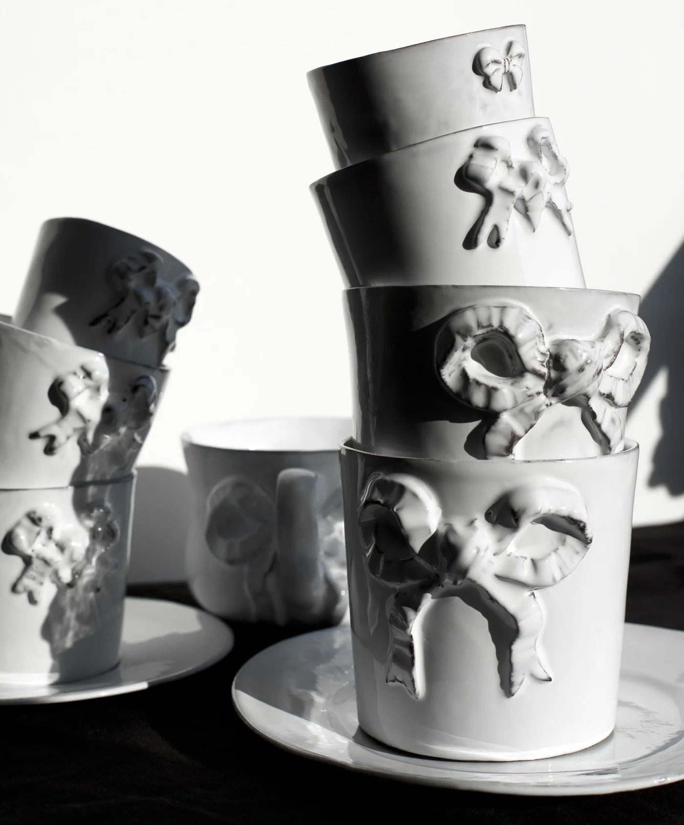 Carron Paris ceramic mug with a delicate embossed ribbon design for coffee and tea, in multiple sizes.