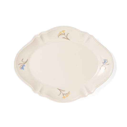 A pack shot of Studio M' Mignardises Plate in a beautiful smooth glaze, featuring an elegant, vintage-inspired relief rim perfect for serving bite-sized desserts.