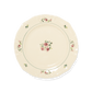 A pack shot of Studio M' Rosier Plate 20cm in a warm, subtle beige glaze, featuring a vintage-inspired red rose motif and an elegantly tiered, hand-painted rim.