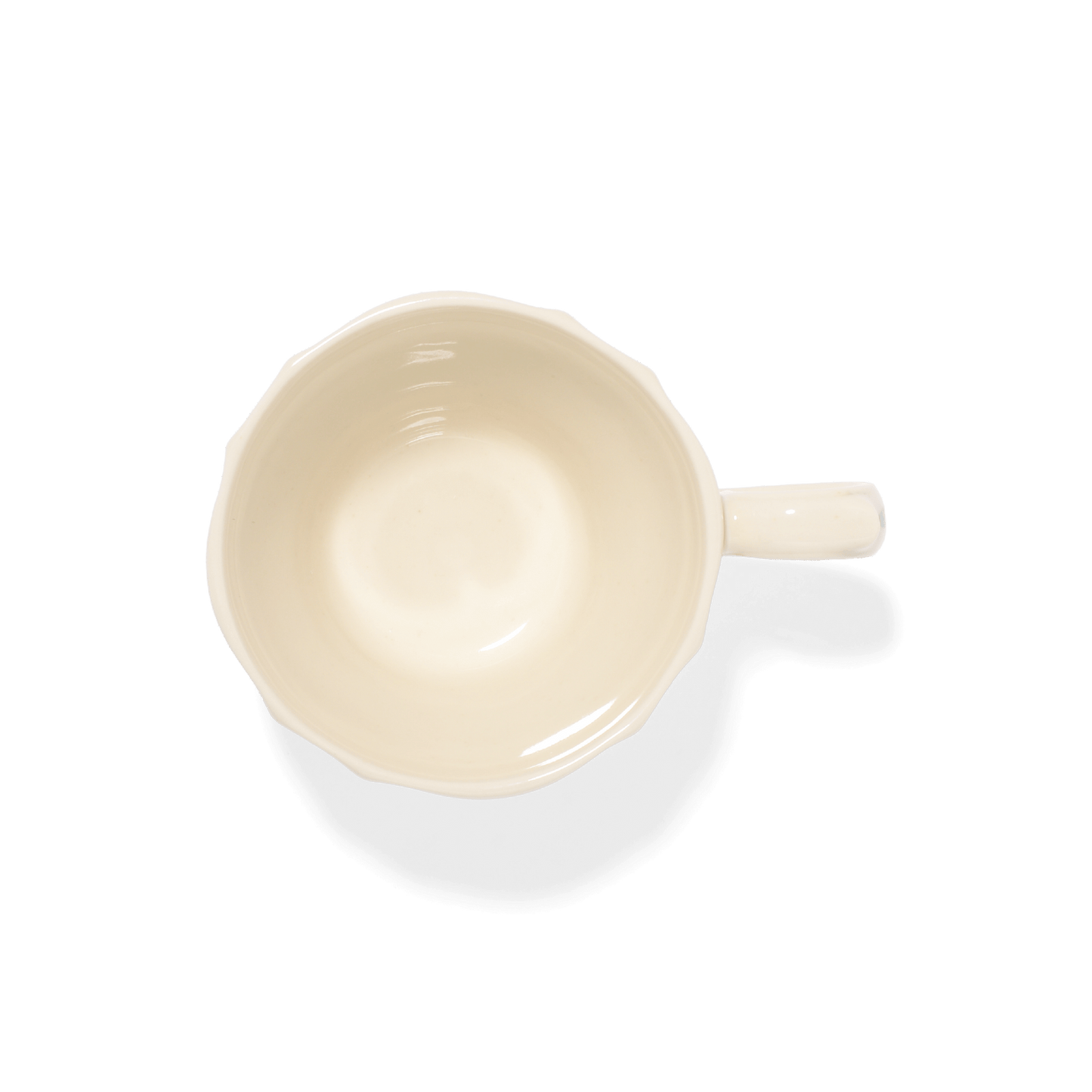 An aerial shot of Studio M' Rosier Mug in a warm, subtle beige glaze.